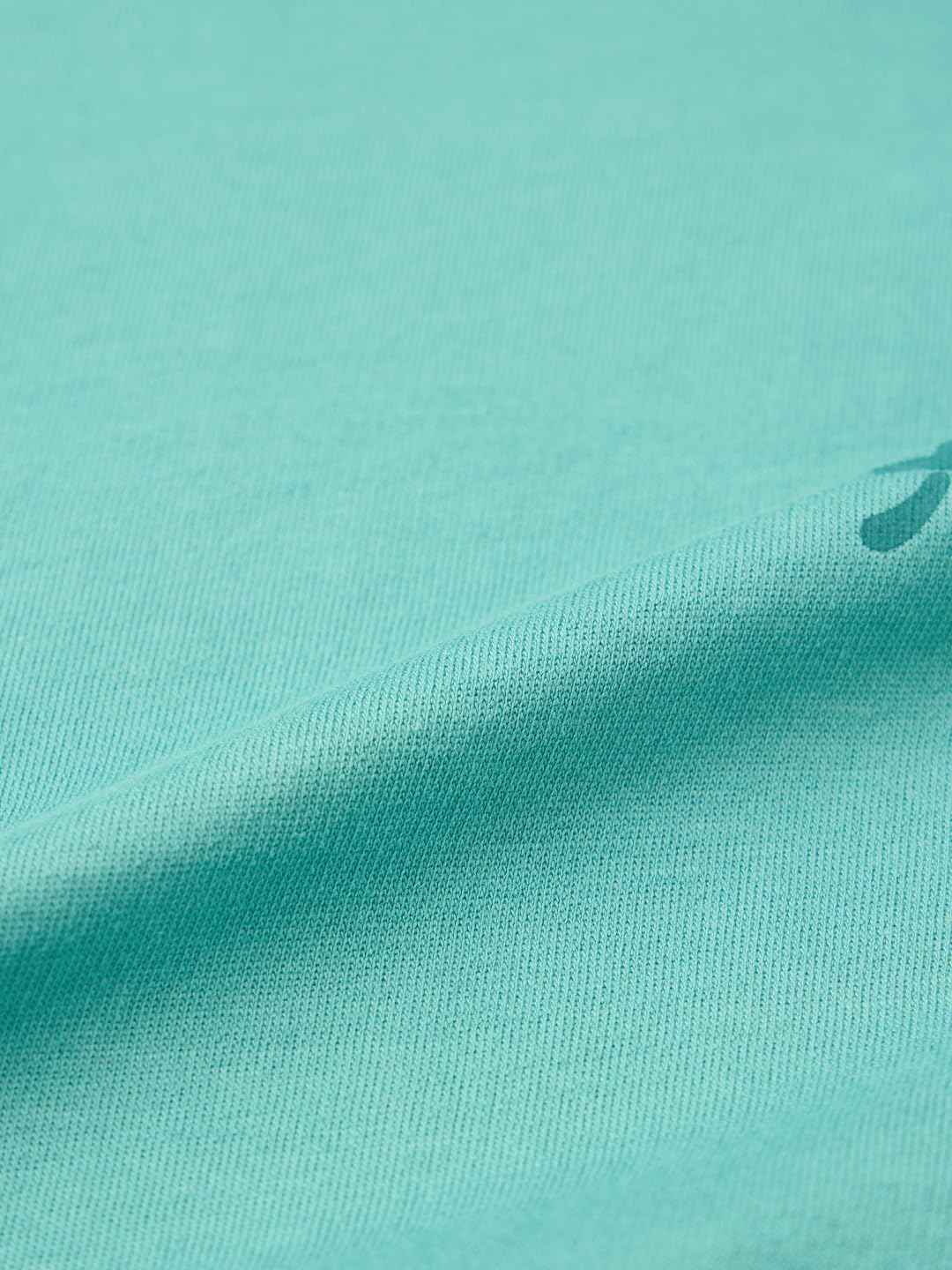 Close-up texture of fabric for Demon Slayer Muichiro T-shirt in light teal color from The Souled Store