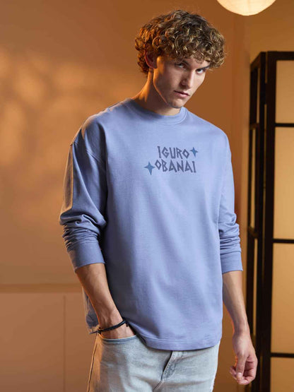 Young man modeling a light blue Demon Slayer Obanai T-Shirt with long sleeves and printed text