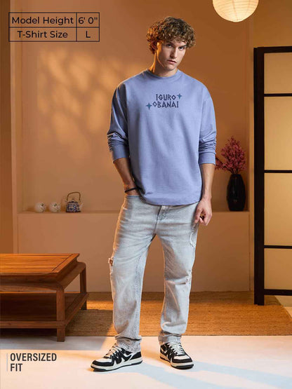 Model wearing Demon Slayer Obanai T-Shirt oversized fit in light purple with light washed jeans