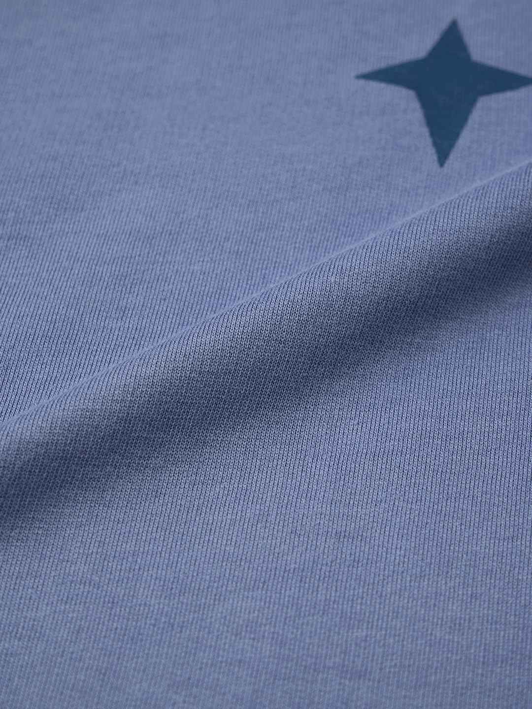 Close-up of blue fabric with a star print detail from Demon Slayer Obanai T-Shirt