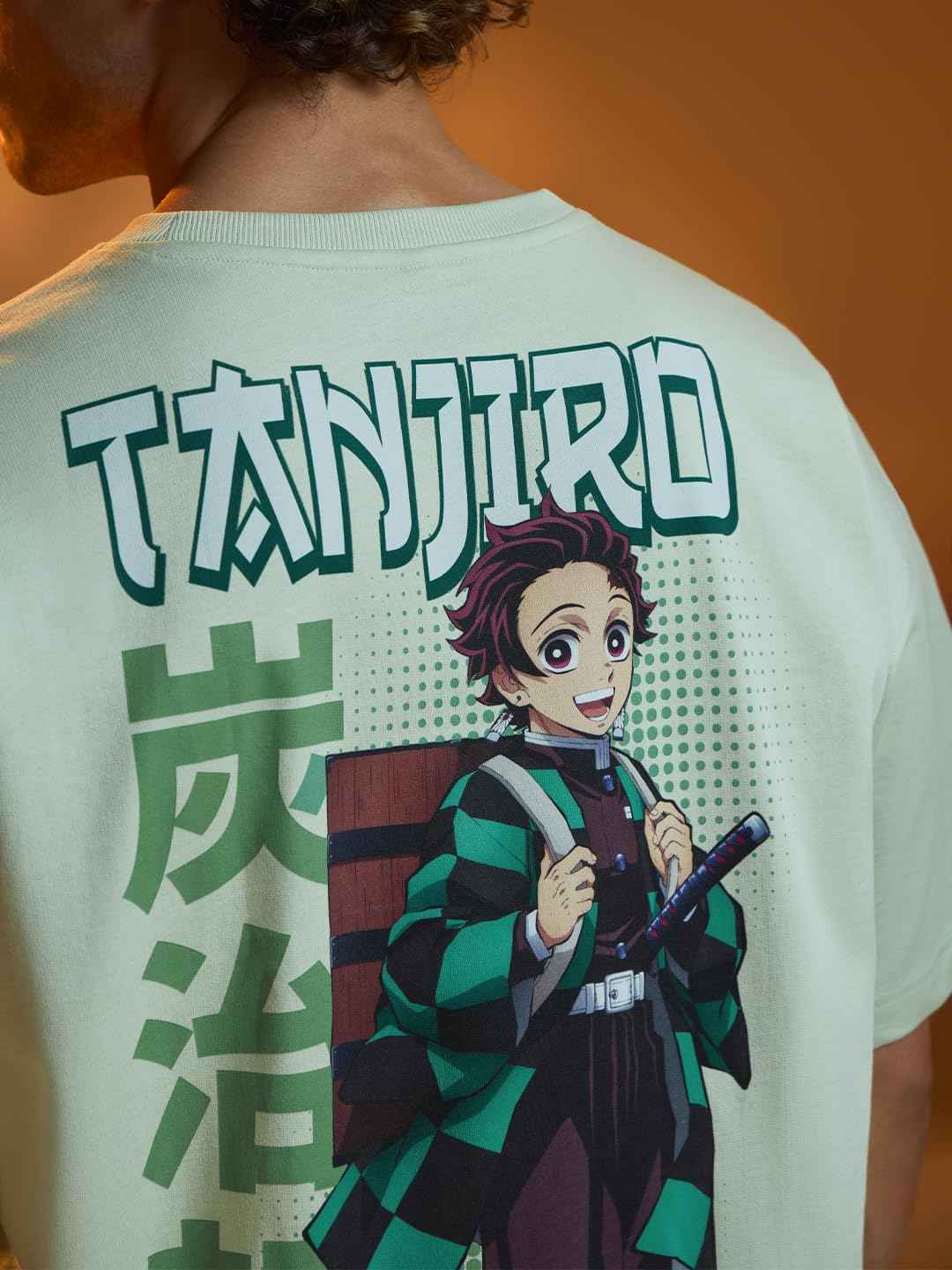 Demon Slayer Tanjiro T-shirt featuring colorful anime character print on the back with bold text