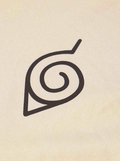 Close-up of black spiral leaf symbol printed on cream Naruto Shippuden oversized t-shirt fabric