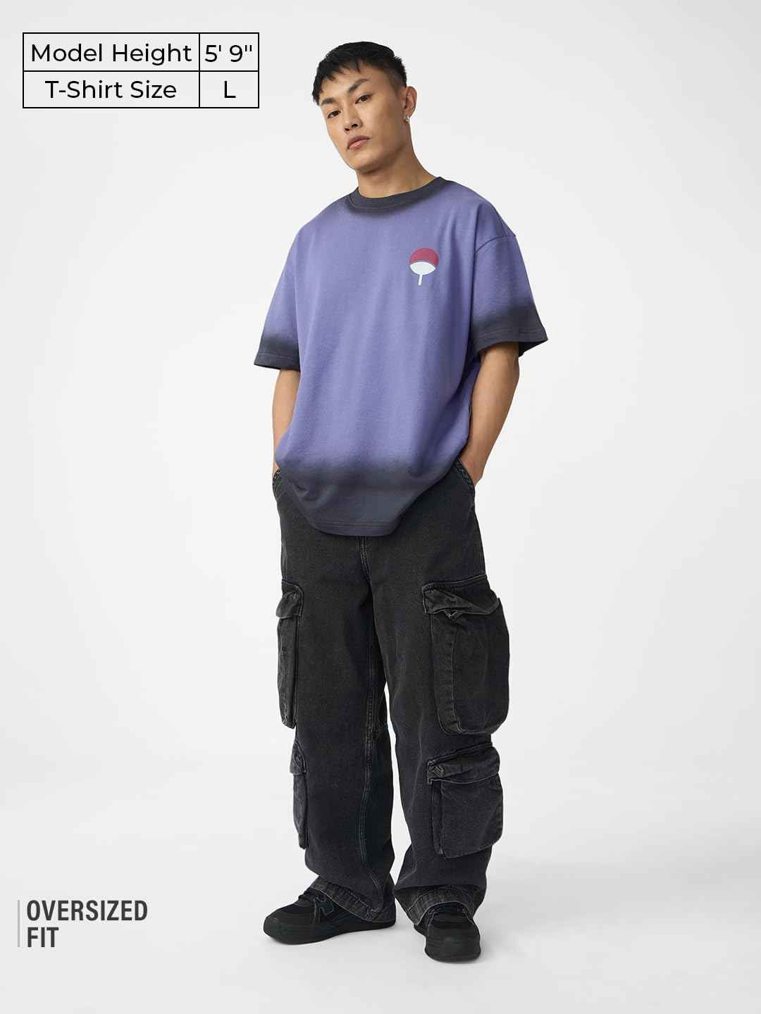 Man wearing oversized Naruto Uchiha t-shirt for men in purple with black trim and black cargo pants