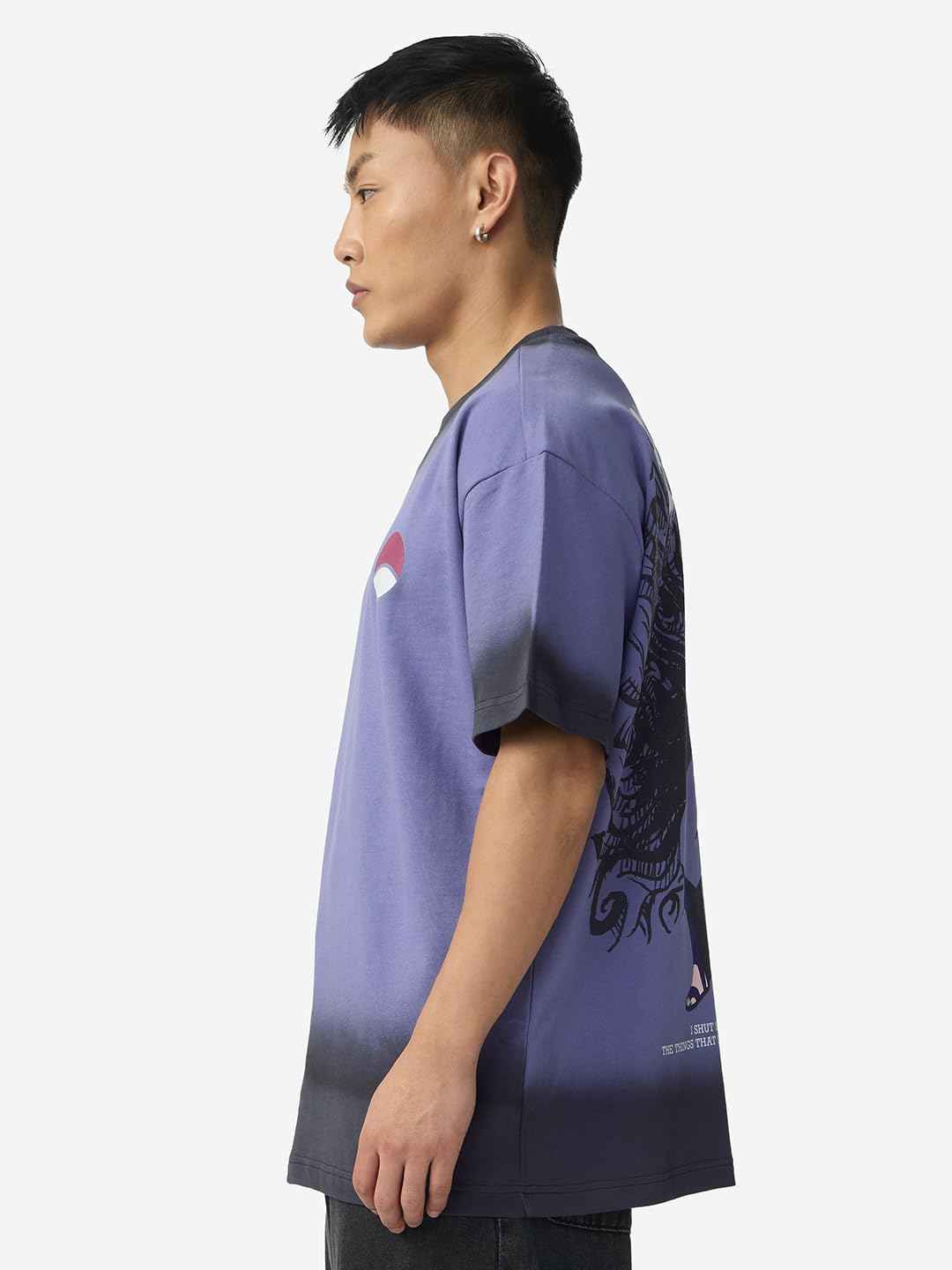 Side view of man wearing Naruto Uchiha t-shirt for men in purple with black gradient and graphic design on back